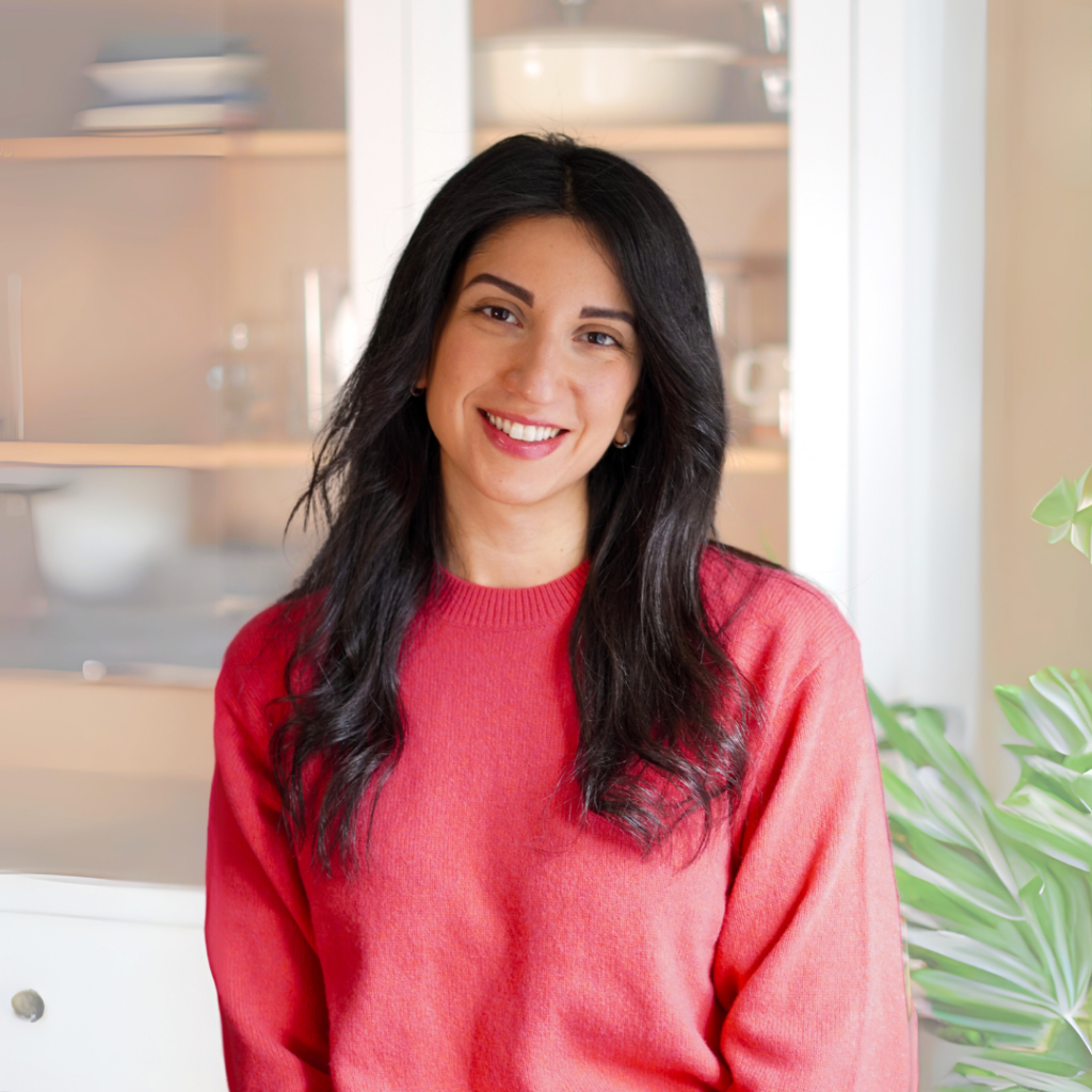 Flo smiling in a kitchen