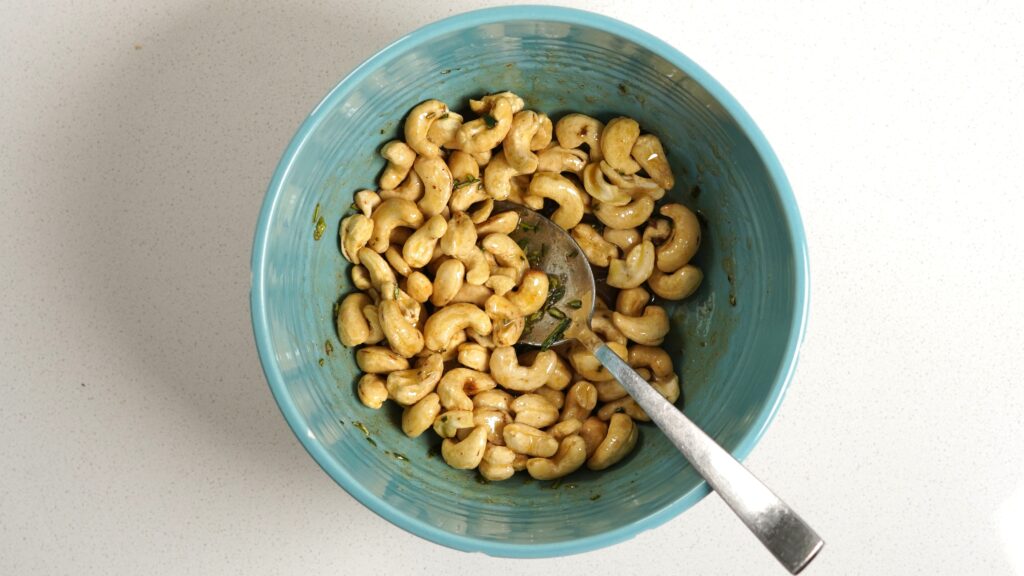cashews in a bowl with spoon