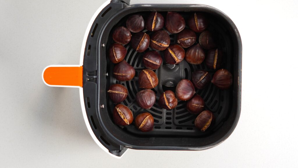 Roasted chestnuts in air fryer basket