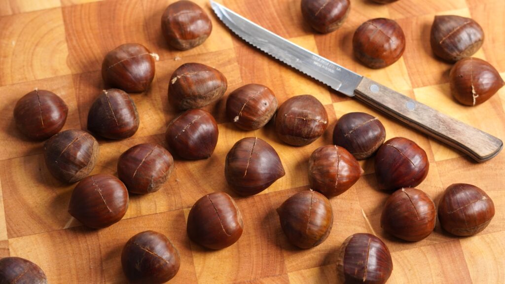 chestnuts on chopping board