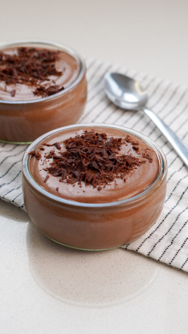 Ramekin of healthy chocolate mousse topped with chocolate shavings