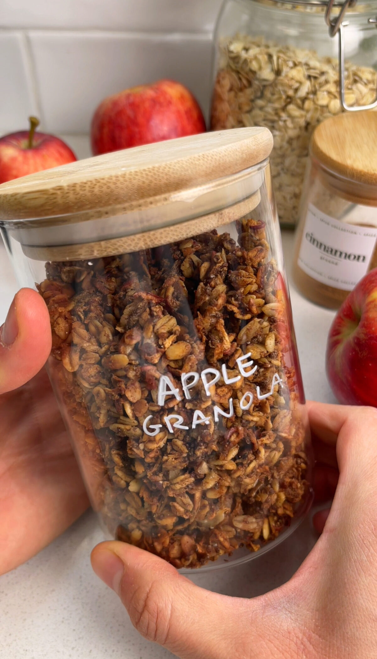 Homemade apple granola with oats in a glass jar