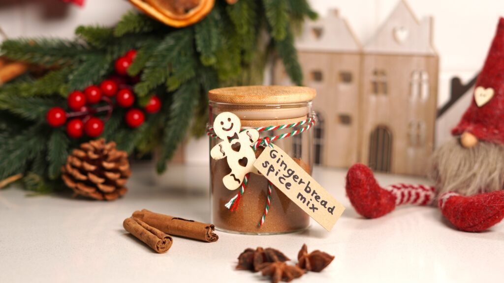 Gingerbread spice mix jar in a Christmas themed background